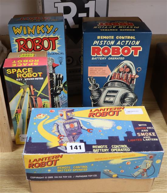 A Rocket USA tinplate R-1 battery-operated robot (bare metal) and four other modern robots,